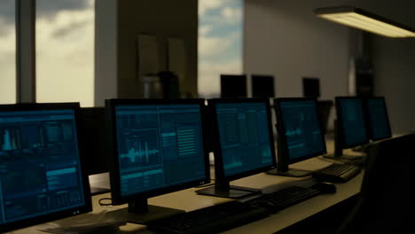control room monitors with cloudy sky view