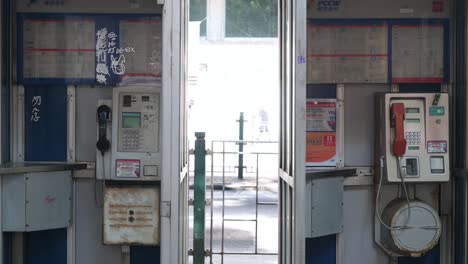 Public-telephone-booths,-also-called-a-payphone,-are-seen-in-the-street-of-Hong-Kong