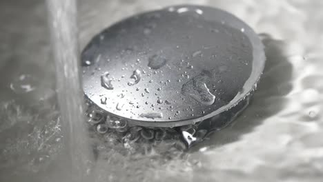 water draining into sink