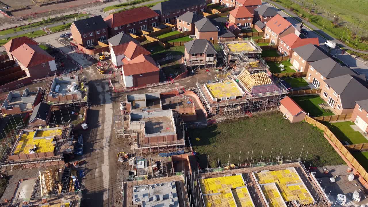 Drone aerial view of house building site in Cheshire, England, UK, Europe, illustrating urban development due to housing shortage in the UK.