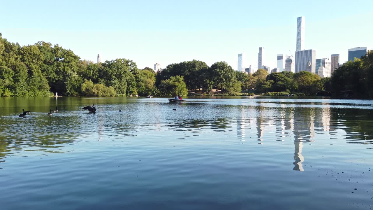 People are sailing on a boat in Central park of New York