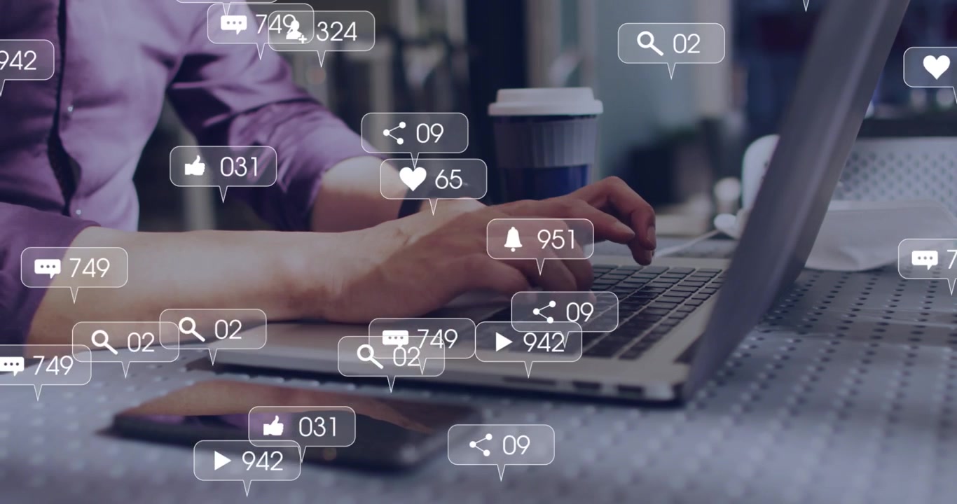 Man typing on laptop, causing alert bubbles rising near phone and coffee, boosting social reach