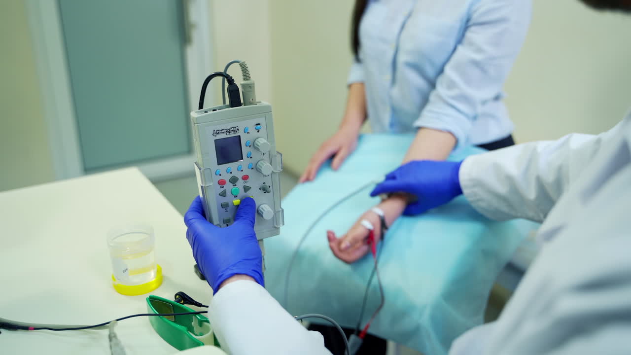 Neurologist testing hand reflex. Close up of neurologist testing reflexes on female patient