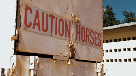 'Caution-horses'-signage-at-back-of-truck-used-to-transport-racehorses-from-stud