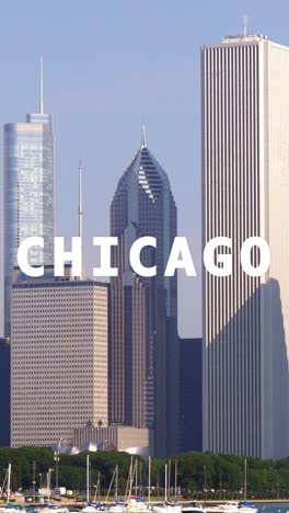 vertical video shot of city buildings and skyline in america illinois overlaid with animated graphic spelling out chicago