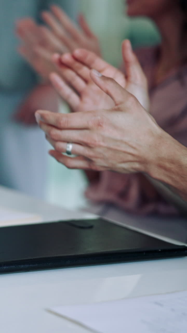 Close-up of People Clapping Hands in an Indoor Setting