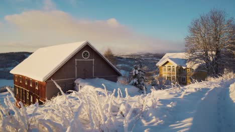 beautful snow landscape with snowy roof of apartment houses in norway during winter in the evening