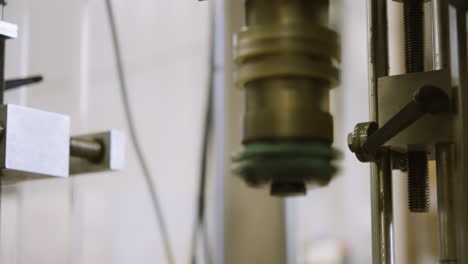 automated shrink wrap machine in action at a wine bottling facility