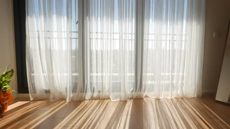 sunlight streaming through white curtains