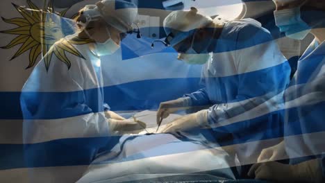 Animación-De-La-Bandera-De-Uruguay-Ondeando-Sobre-Cirujanos-En-Quirófano