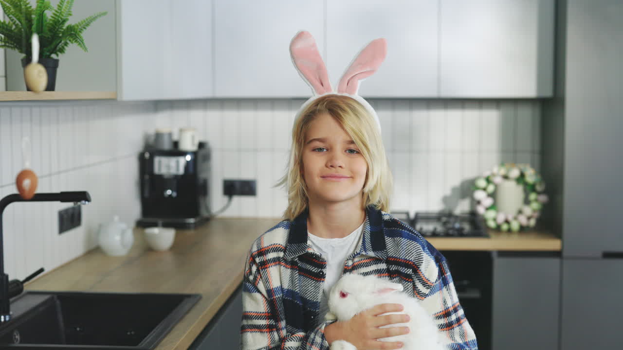 Boy with Easter Bunny in Kitchen