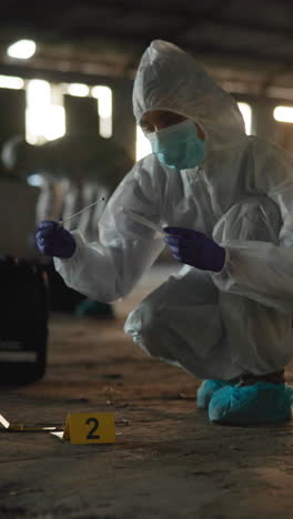 forensic investigators collect evidence at a crime scene