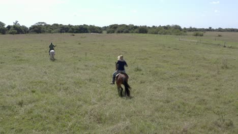 Men-on-horseback-through-the-Venezuelan-countryside