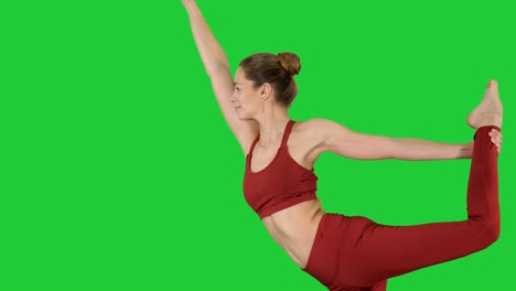 yoga teacher practising pose dandayamana dhanurasana on a green screen, chroma key