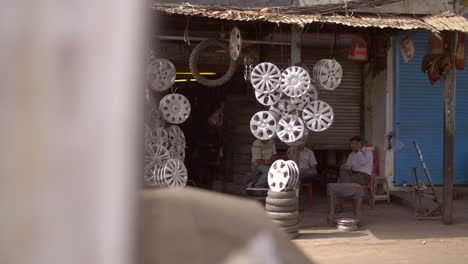 Tracking-Past-Men-Sat-Outside-Workshop