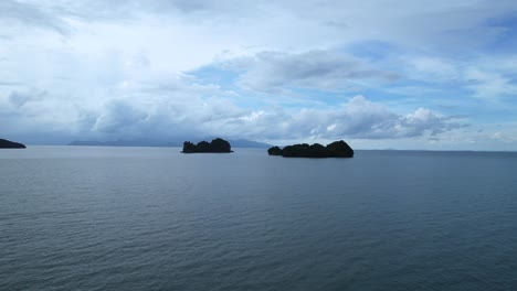 aerial shot of the silhouettes of palau pasir island, malaysia