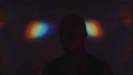 man dancing in kaleidoscopic projection