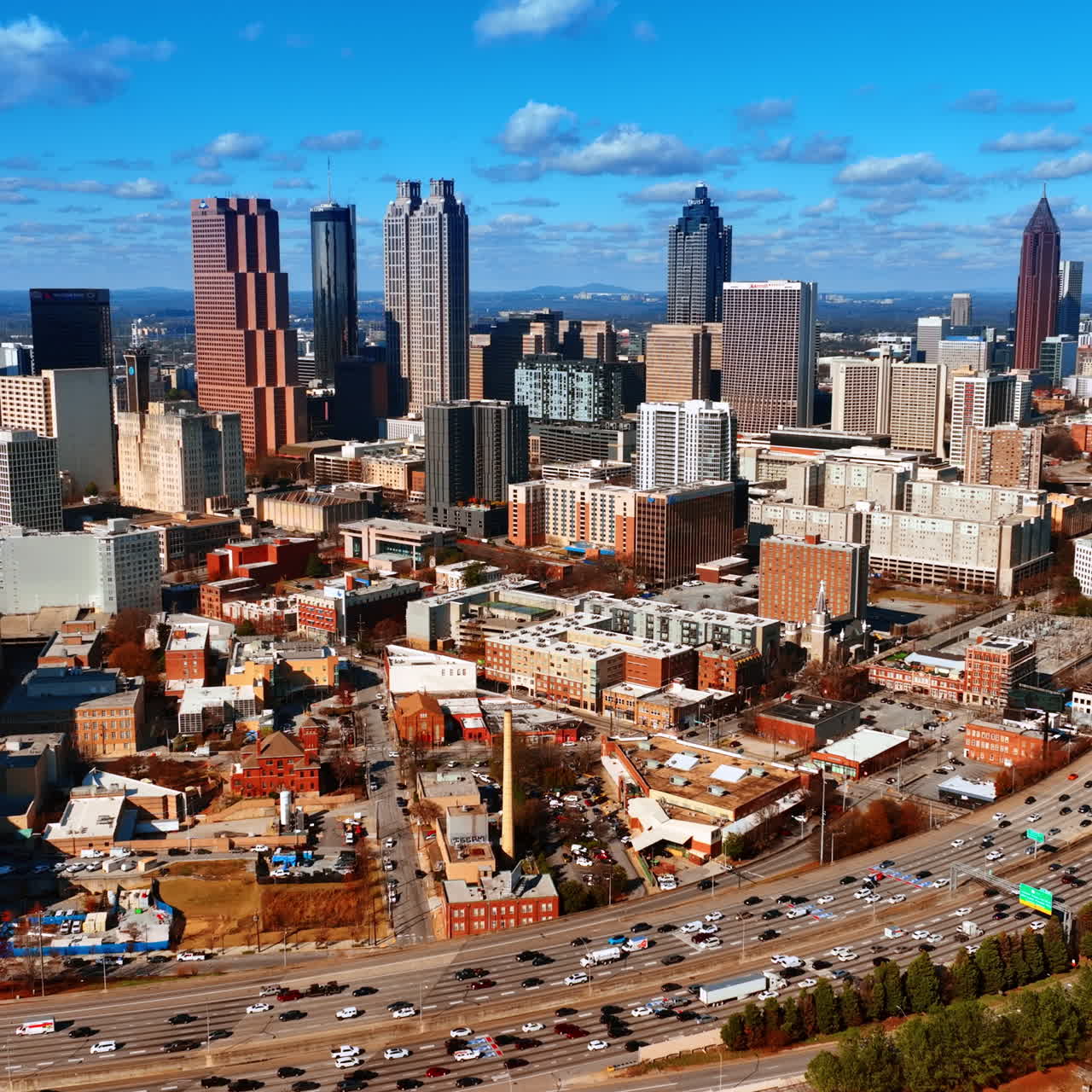Scenic daytime view of huge metropolis downtown with heavy traffic. Panorama of Atlanta, Georgia, USA from top.