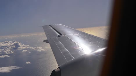 Passenger-POV-of-plane-ascending-after-take-off-climbing-to-the-right-altitude