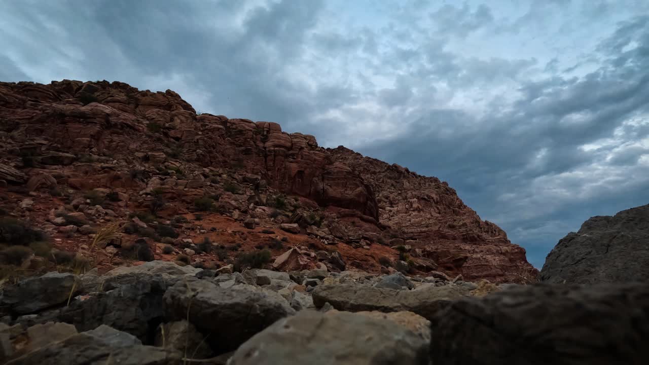 Full sky of clouds time lapse over red rocks