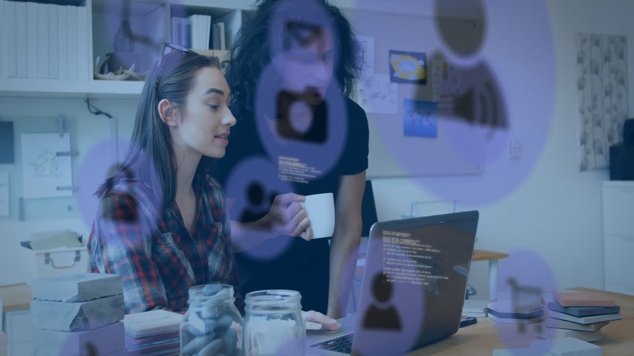 Two people working at desk with social media icons animation overlay
