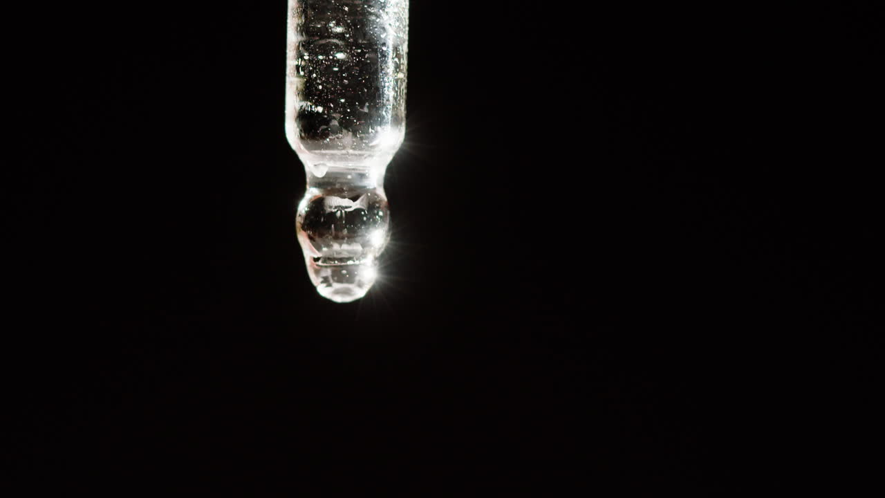 Close-up of a glass dropper bottle