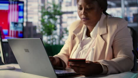 woman paying online with credit card