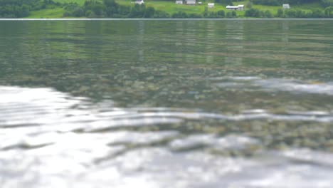 crystal clear fjord water filmed near alesund,  norway.