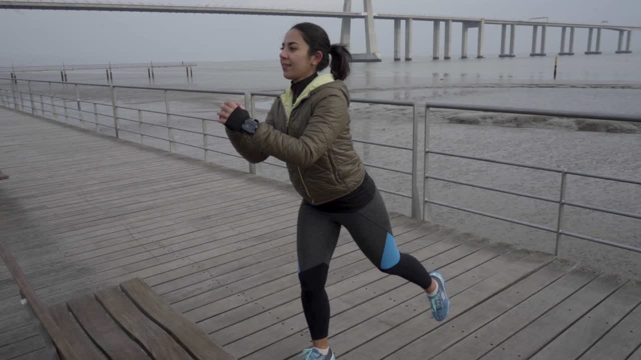 Smiling hindu woman with ponytail training outdoor
