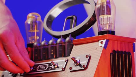Old Retro AM FM Radio with tubes, Hand Changing stations , bulb vintage music player.