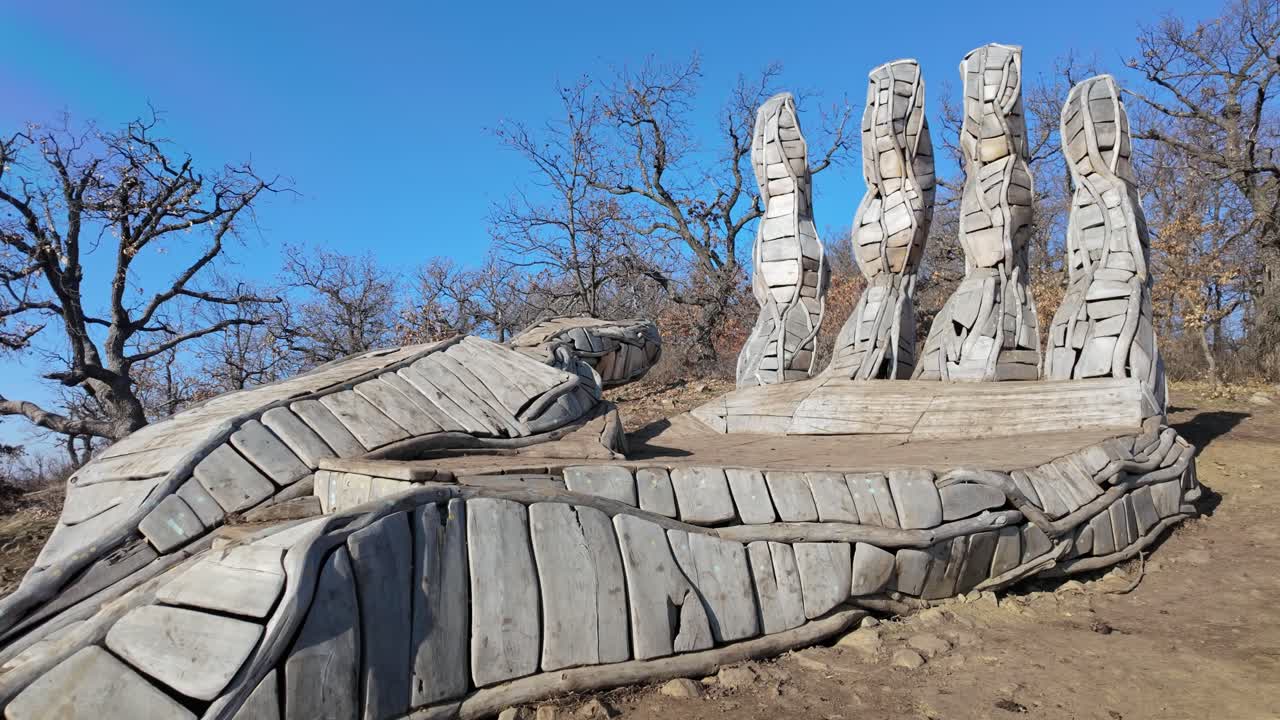 Static shot of Palm of God wooden tourist attraction during the day in Holloko, Hungary.