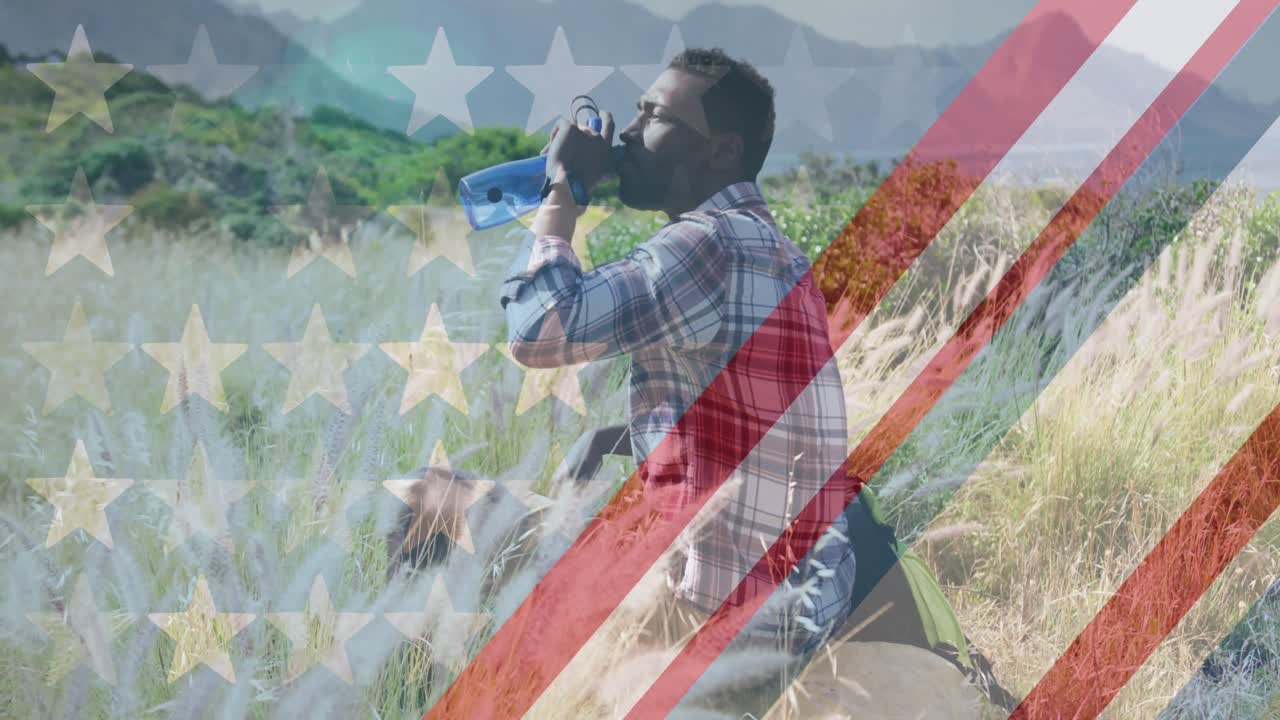 산에서 물을 마시는 아프리카계 미국인 남성 위에 있는 미국 국기의 애니메이션