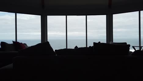 from the dark contrast shadows of a bright day, the perspective pushes forward towards a wide-angle view of a south african beach