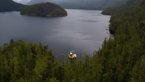 Floating-sauna-surrounded-by-Emerald-Edge-rainforest,-Tofino,-BC