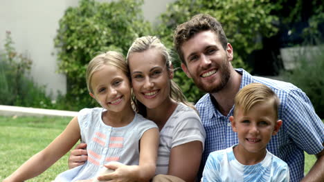 smiling family posing for the camera