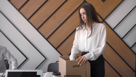 Sad-Young-Woman-Communicating-Her-Co-Workers-About-Leaving-The-Company