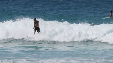 surfers riding and maneuvering on ocean waves