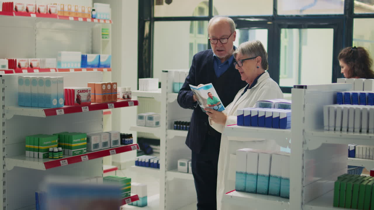 Pharmacist consulting with customer in pharmacy