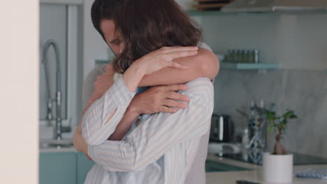 happy young couple dancing at home enjoying dance together having fun celebrating relationship