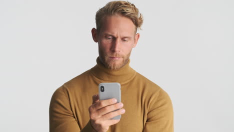 man reading news on smartphone