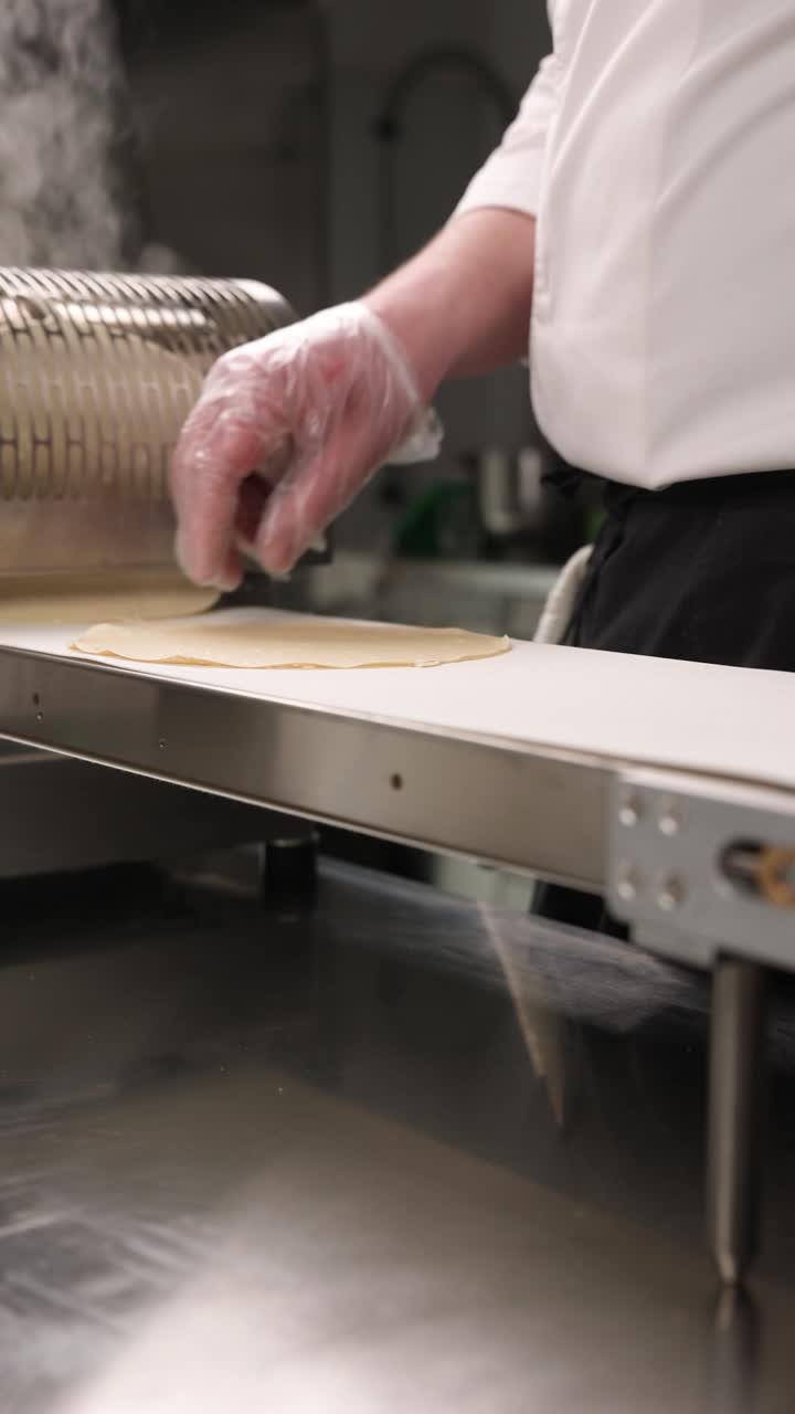 Chef Preparing Dough on Conveyor Belt
