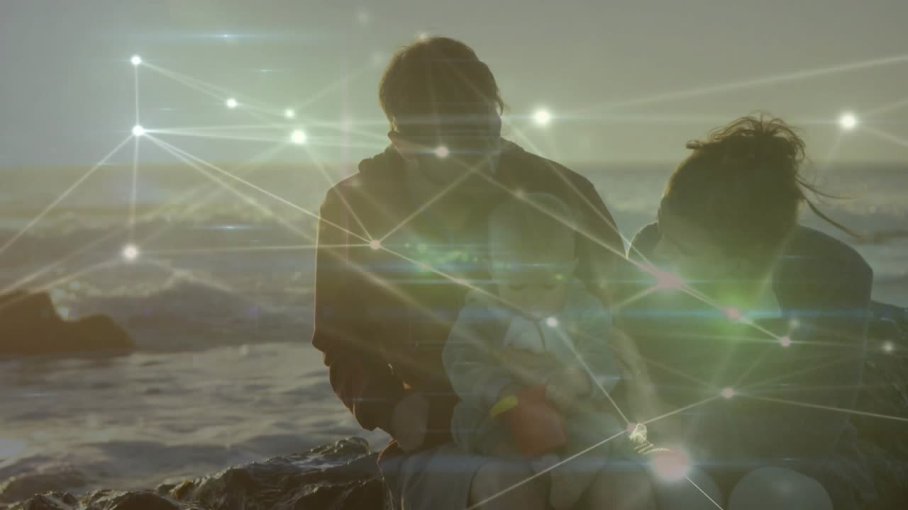 Sun glare and node overlay starting shore father bending mother reaching revealing infant for care