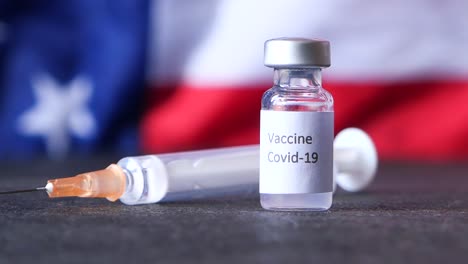 covid-19 vaccine and syringe