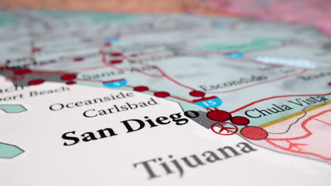closeup of fabric map showing san diego and nearby cities in california, usa. zoom-in shot, racking focus