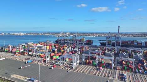 Aerial view of Melbourne shipping terminal with cranes containers and cargo ships docked