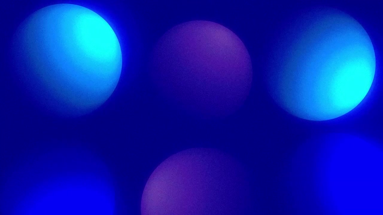 Animation of floating 3D sphere balls with shadows moving and wiggling through an abstract space on a dark gradient background dynamic motion graphics and visual effects vibrant colours blue purple