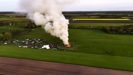 aerial view of a bonfire celebration in a field