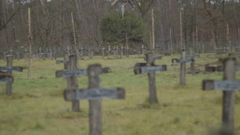 several focus racks of rows of crucifixes at abandoned graveyard