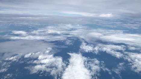 view of clouds from the window of the airplane