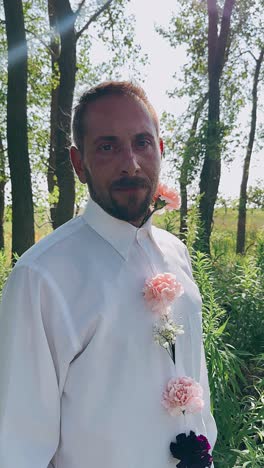 man in a white shirt with pink flowers